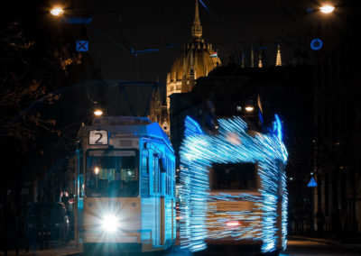 Long exposure photography of two trams with lights on